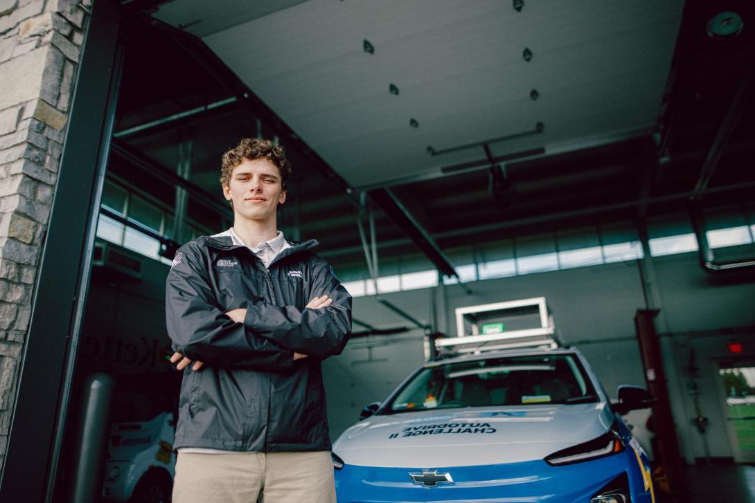 student standing in front of autodrive bolt